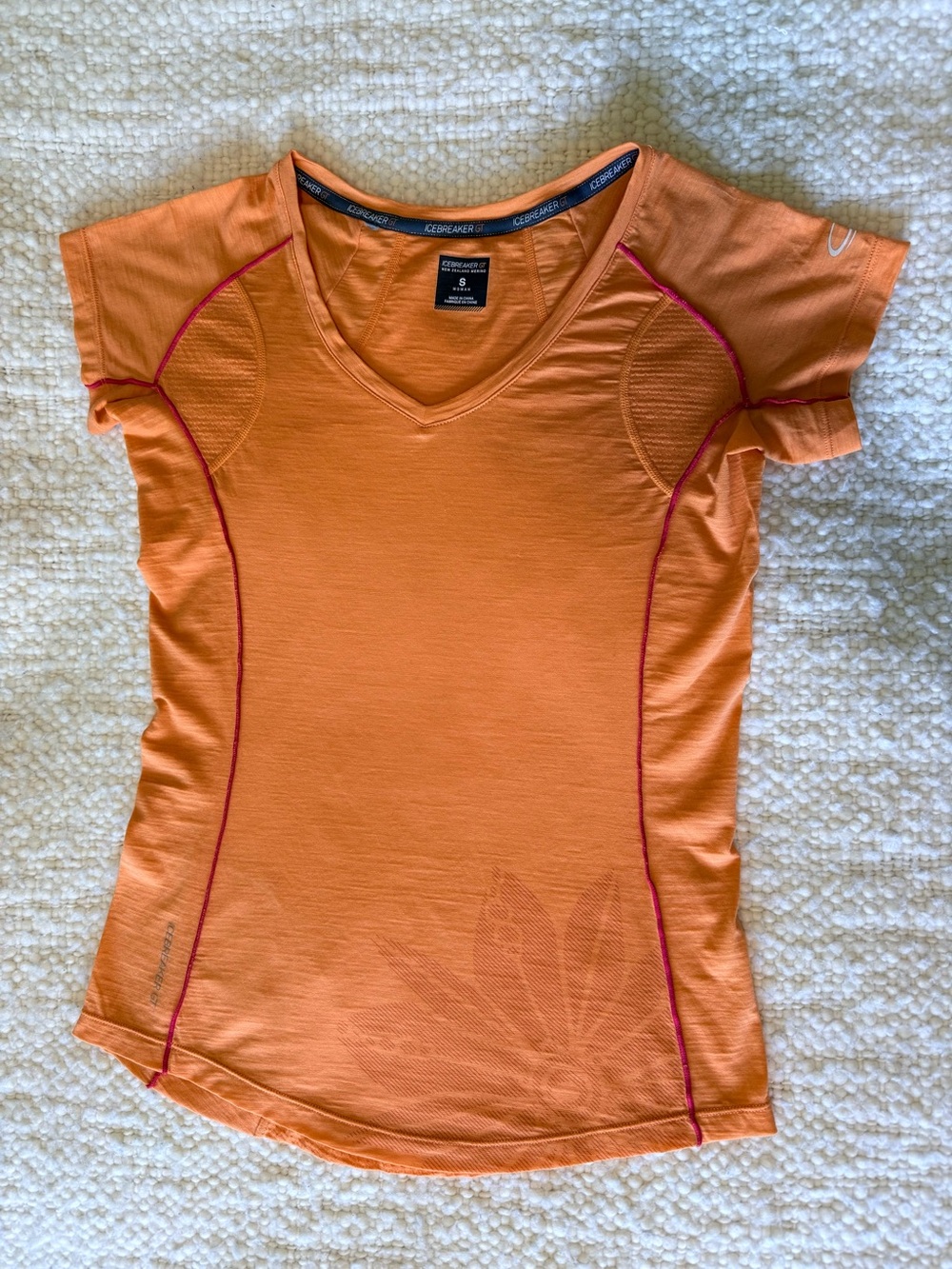 Icebreaker Orange Short Sleeve V-Neck Merino Wool Shirt.